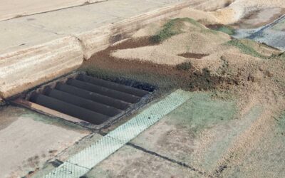 The March Sand Dam: Why Winter’s Traction Grit is Your Drainage System’s Greatest Spring Threat